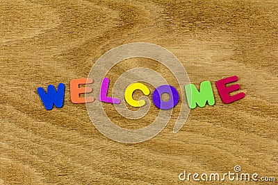 Welcome greeting wood color children letters plastic Stock Photo