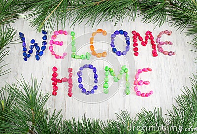 Welcome home note written with small rocks Stock Photo