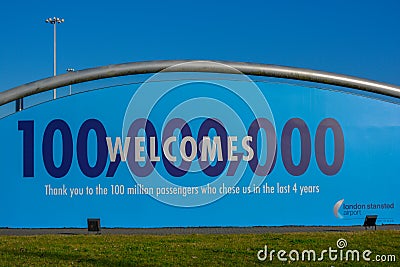 A welcome sign board outside of London Stansted airport. Billboard the thanks 100million passengers and tourists in Europe Editorial Stock Photo