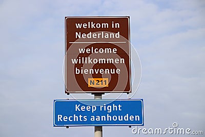 Welcome sign at Hoek van Holland for travelers from England with warning to keep right for driving lane. Editorial Stock Photo