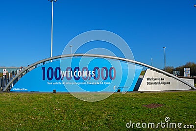 Welcome sign in London Stansted airport, huge billboard thanks 100 million passengers, welcome sign board for english travellers Editorial Stock Photo