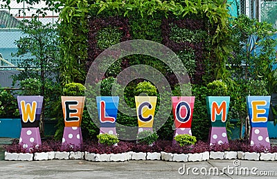 Welcome sign word on flower pots Stock Photo