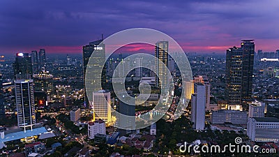 Welcome statue with skyscraper at night time Editorial Stock Photo