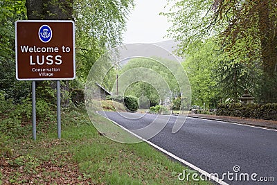 Welcome to Luss village sign greeting entrance rural countryside town near Loch Lomond Scottish place Editorial Stock Photo