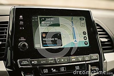Welcome to Oklahoma text message appear on screen of real-time GPS navigation maps application on display audio Stock Photo