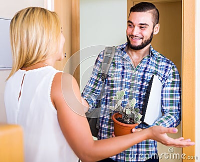 Welcomes guests at the entrance Stock Photo