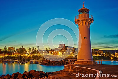 Welcoming Night at Breakwater Lighthouse Stock Photo