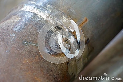 Weld inspection Weld defect. Defective welded butt seam of the pipeline and branch Du50 Stock Photo