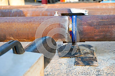 Weld inspection Weld defect. Defective welded butt seam of the pipeline Stock Photo