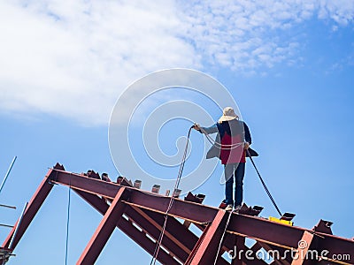 The Welder man a welding the steel roof. Editorial Stock Photo