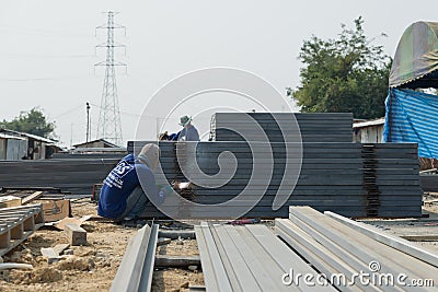 The welder without personal safety protection welds metal Editorial Stock Photo