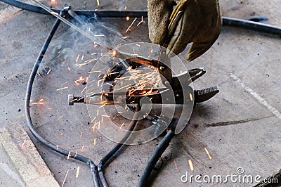 Welder Welding Sparks steel in factory Stock Photo