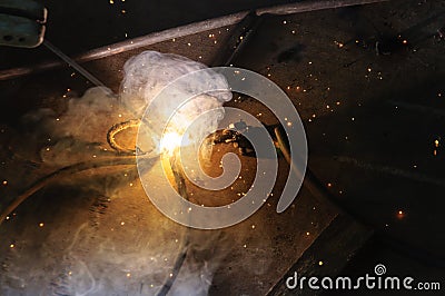 Welder Welding Sparks steel in factory Stock Photo