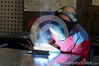 Welder works in the metall industry - portrait Stock Photo