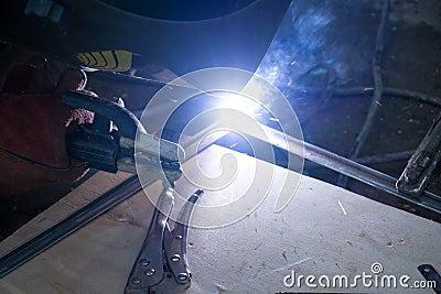 Welders working at the factory made metal Stock Photo