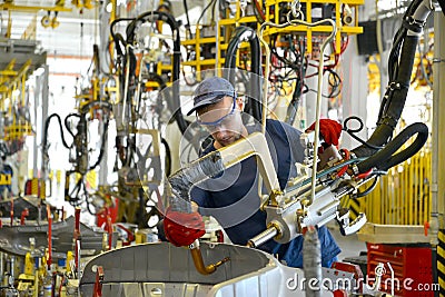 Welding of a body of the car device of spot contact welding. Automobile production Editorial Stock Photo