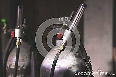 Welding equipment acetylene gas cylinder tank with gauge regulators manometers. Stock Photo