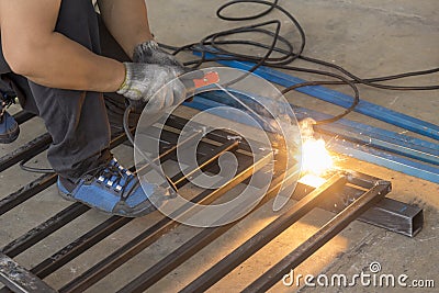 The welding operator welding the tube Stock Photo