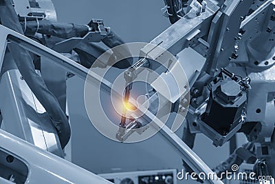 The welding robotic machine welding the automotive parts . Stock Photo