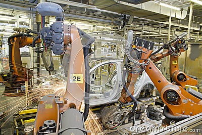 Welding robots in car production plant Stock Photo