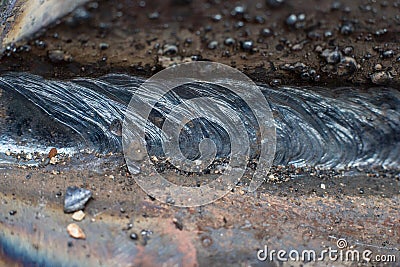 Welding seam on metal close at construction Stock Photo