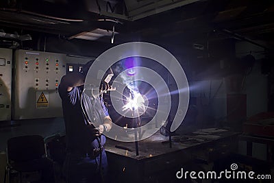 Welding technician, carrying out welding work in the workshop Stock Photo