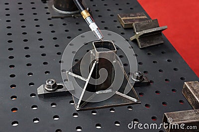 Welding work and welding tool to joint metal workpiece with Welding MIG. Stock Photo