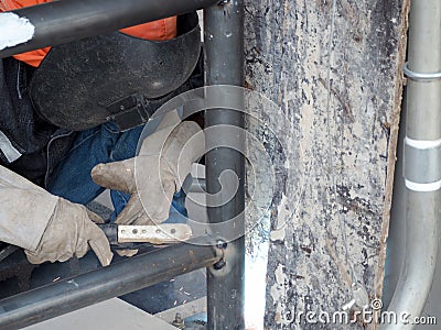 Welding work ,worker with protective welding metal Editorial Stock Photo