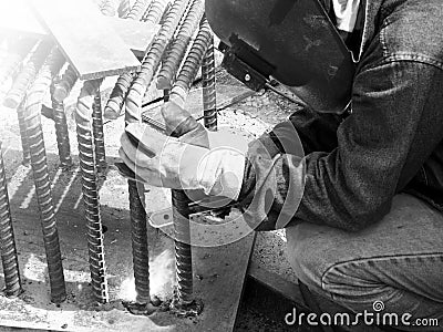 Welding work, worker with protective welding Editorial Stock Photo