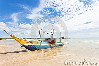 Weligama Beach, Sri Lanka - A traditional fishing boat at the sa Editorial Stock Photo