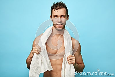 Well build awesome happy handsome man with a towel around neck Stock Photo