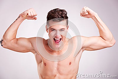 Well-built muscularyoung man screams Stock Photo