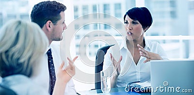 Well dressed business people in discussion at office Stock Photo