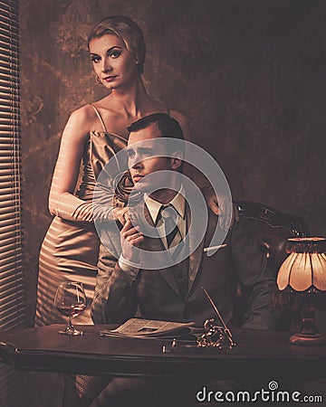 Well-dressed couple in cabinet Stock Photo