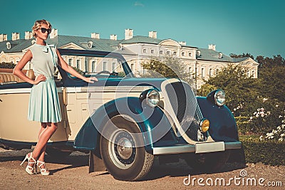 Well-dressed lady near classic convertible Stock Photo