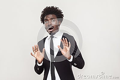 Well dressed man looking at camera with shocked face. Stock Photo