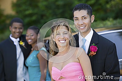 Well-dressed teenage couple outside car portrait Stock Photo