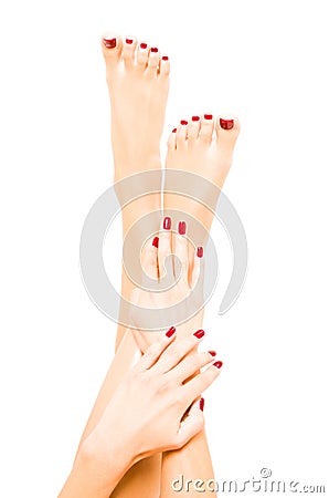 Well-groomed female feet and hands Stock Photo