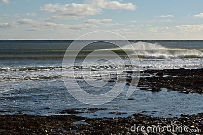 Well lit right breaking wave lining up perfectly at reef break o Stock Photo