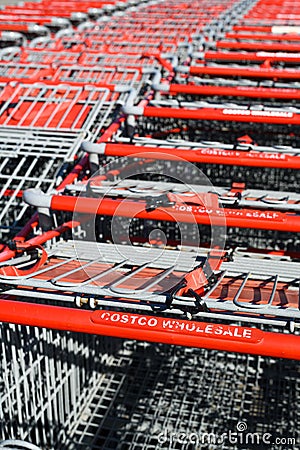 Well worn handles of Costco Wholesale shopping carts Editorial Stock Photo
