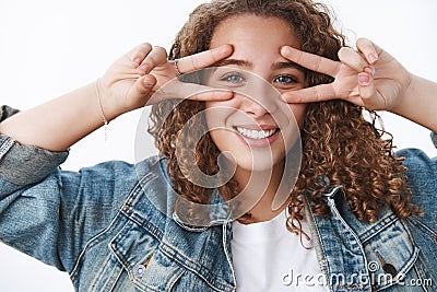 Wellbeing, happiness body-positivity concept. Attractive carefree smiling european woman curly hairstyle denim jacket Stock Photo