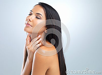 Wellness, shine and woman with dermatology, beauty and glow on grey studio background. Person, model and girl with Stock Photo