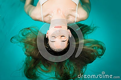 Wellness - young woman floating in Spa Stock Photo