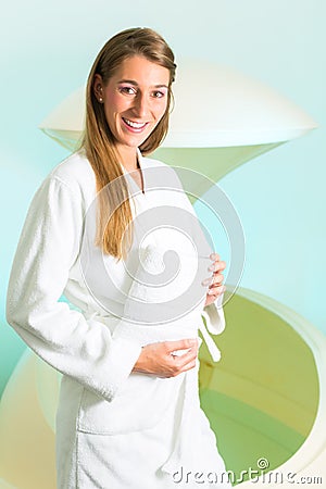 Wellness - young woman floating in Spa in Tank Stock Photo
