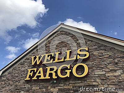 Davie, Florida, USA - Feb 2,2020: A Wells Fargo Bank sign at a Wells Fargo Facade nice sky in the background. Editorial Stock Photo