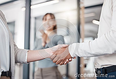 Were going to do great things. two unrecognizable businespeople shaking hands in an office at work. Stock Photo