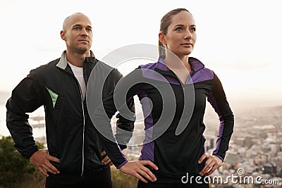 Were going to own this workout. a young couple exercising outdoors. Stock Photo