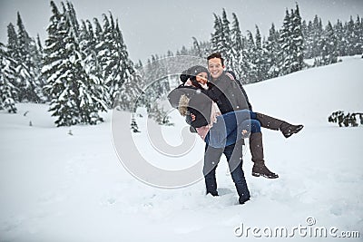 Were out on another adventure. a happy young couple enjoying themselves while being out in the snow. Stock Photo