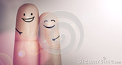 Were two of a kind. Cropped shot of fingers with smileys drawn on them. Stock Photo