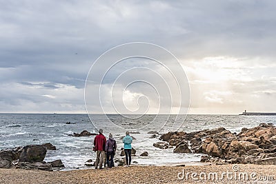 West coast of the Atlantic ocean coast with a group of young people in Porto, Portugal Editorial Stock Photo